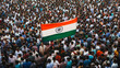 © VK Studio - A sea of people gathered in a large crowd, holding high the Indian national flag amidst a vibrant atmosphere of unity and patriotism.