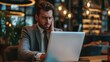© Daniel - The Frustrated businessman at laptop.