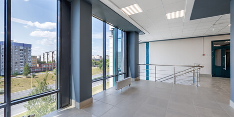 Sticker - panorama view in empty modern hall with columns, doors and panoramic windows.