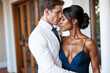 © Sweeann - An elegant young man and woman of different race and ethnicity in a romantic relationship, dressed up for a prom date, sharing intimate embrace, lost in love. An interracial couple passionate romance.