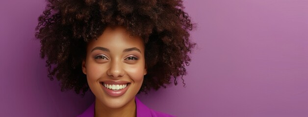 Wall Mural - Smiling Woman With Curly Hair Against Purple Background