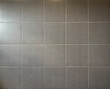© Timothy Roesdiah - Square dark grey porcelain ceramic tiles suitable for floor and walls.
