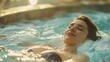 © Boraryn - A woman relaxing in the jacuzzi of a spa, eyes closed and relaxed in a hot water bath, enjoying her relaxation time, wellbeing, health and bodycare concept