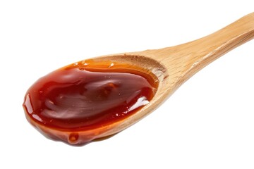 Poster - A wooden spoon filled with ketchup on a white surface, great for food photography or illustrations