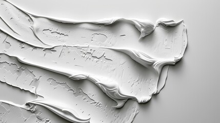 Wall Mural -  A tight shot of white paint dripping onto a white backdrop, with droplets forming at the point of origination