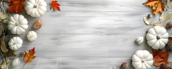 Top view of background with white pumpkins and fall foliage with copy space.