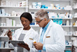© ReeseArcurs/peopleimages.com - Healthcare, people and discussion with clipboard in pharmacy for inventory, inspection and advice. Medical, intern and pharmaceutical student with mentor by pills for dispensary, supply and checklist