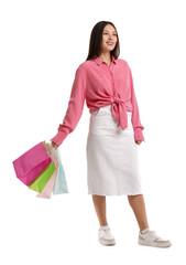 Poster - Young Asian woman with shopping bags on white background