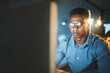 © JorSons/peopleimages.com - Office, computer and business man in dark for website, research and web design software. Corporate, thinking and worker on pc working late for programming, information technology and cybersecurity