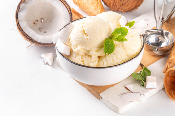 Wall Mural - Vegan creamy coconut sorbet ice cream. Bowl with classic white coconut flavor non-dairy vegetarian gelato made with coconut milk, creamy frozen summer dessert