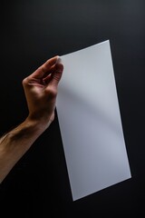 Aufkleber - A person holding a piece of paper in their hand, possibly with important information or a message