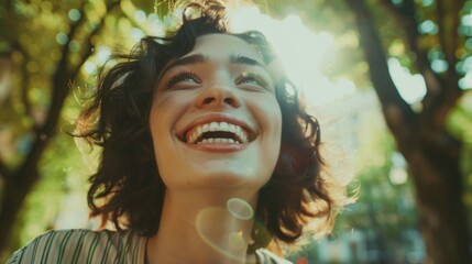 A happy woman blowing colorful bubbles into the air