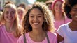 © Marco - beautiful woman smiling in pink shirt in a group of women at a world breast cancer day march