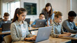 © NewFresh  - education, high school, technology and people concept - group of students with laptop computers in classroom