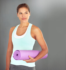 Poster - Woman, fitness and yoga mat on gray background for exercise, wellness and health as morning routine. Female person, pilates and thinking with equipment or idea for challenge, progress and self care