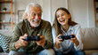 © NewFresh  - Happy family playing video games at home. Grandfather and granddaughter spending time together.