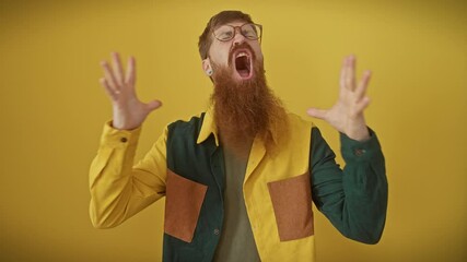 Canvas Print - Frustrated redhead man in glasses kicks off a crazy rant, arms flailing madly over isolated yellow backdrop