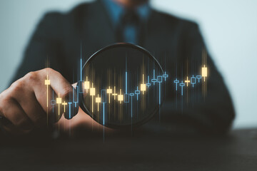 Poster - Stock trading and investing concept. Businessman or trader hand holding magnifying glass with virtual stock graph market chart. foreign exchange, trade fund, crypto money, Business growth, investor.