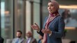 © Anna - Muslim businesswoman gives a presentation in a modern office, confidently addressing her colleagues The scene reflects professionalism and the breaking of stereotypes