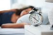 © Chanelle M/peopleimages.com - Alarm, clock and woman sleeping in bed with depression, tired or anemia and low energy or fatigue at home. Time, late and person dreaming, relax or lying with risk of iron deficiency or hypersomnia