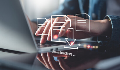 Business man downloading computer files or installing software on laptop computer, cloud storage technology, data backup, cyber security, document downloading