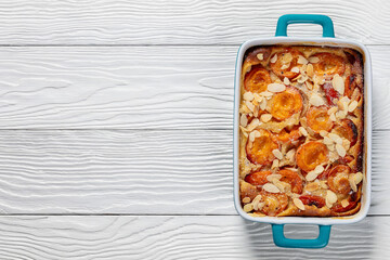 Wall Mural - apricot clafoutis, apricot tart in a baking dish