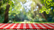 © SU CrossCutting Film - Red checked tablecloth on wood with blur green bokeh of tree background.Summer and picnic concepts.Design for key visual food and drink products.