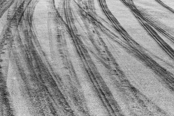 Wall Mural - Aerial view Textured background vehicle trace on asphalt road, Tire print texture background transport, Car tire mark burnout texture and background, Tire mark on the asphalt road race track.