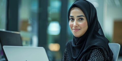 Poster - Portrait of a Muslim Woman in a Modern Office