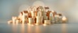 © Wimstock - Stacking Coins and Miniature Houses Symbolizing Financial Growth and Real Estate Investments