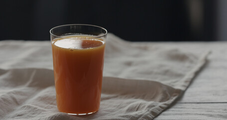 Wall Mural - pumpkin juice in tumbler glass on linen cloth