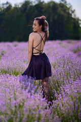 Wall Mural - Beautiful young latin woman in lavender field