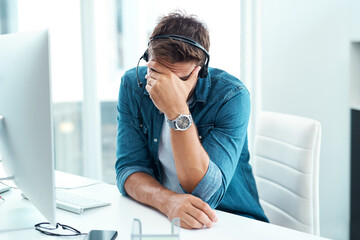 Wall Mural - Tired, headset and man with headache, desk and consultant in agency, exhausted and customer service in office. Mic, connection and call center with tech, communication and telemarketing with migraine