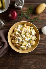 Wall Mural - Warm potato salad with egg, pickle, red onion with mayonnaise an