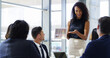 © ArcursPI/peopleimages.com - Meeting, presentation and tablet with business people in boardroom of office together for feedback. Report, smile and technology with woman employee talking to clients in workplace for introduction