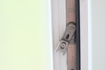 Poster - A detailed shot of a door latch and its mechanism, often used in interior design or DIY projects.