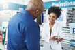 © peopleimages.com - Pharmacist, customer and woman with medicine in clinic of product care, advice and information for prescription. Healthcare, person and client with pills for pharmaceutical, instructions and safety
