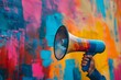 © Elmira - A hand holds a blue megaphone against a vibrant abstract studio background, emphasizing the power of communication and creative expression