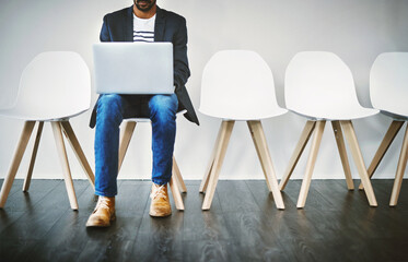 Aufkleber - Waiting room, business person and laptop for recruitment, planning or research questions for hr interview. Wall background, male candidate or digital for information, opportunity or reading portfolio