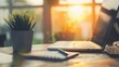 © amorn_m - Laptop on desk with sunlight streaming through window.