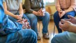 © Oulaphone - Support group patients comforting person at therapy session, diverse individuals sharing and listening, community healing.