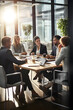© Augusta - Diverse Team Engages in Strategic Meeting in Modern Corporate Conference Room