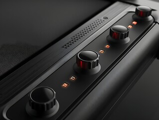 Close-up of black knobs and glowing buttons on a sleek, modern device.