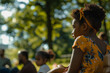 © Purple_Lamp - Young Girl at Outdoor Gathering in Natural Park Setting with Family