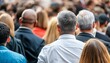 © intricateflow - A crowd of people at a rally or a conference; back facing the camera