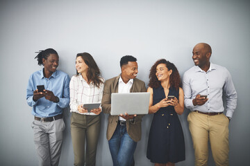 Poster - Laptop, tablet and line of business people in office for hiring, job interview and networking. Diversity, phone and men and women on technology for queue, recruitment or onboarding on wall background