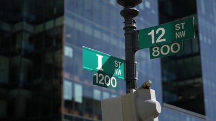 I street NW and 12th street NW street signs in downtown Washington DC symbolizing lobbying and corruption in nations capital