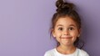 © Pinklife - A delightful young girl with a top bun hairstyle, smiling brightly against a purple background, encapsulating innocence and happiness in a simple yet powerful way.