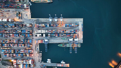 Aerial top view of Container ship loading and unloading, Cargo container in deep seaport for the international order concept.