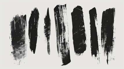 A set of various black ink brush strokes, each with distinct intensity and texture, laid out on a white background, emphasizing their unique artistic qualities.